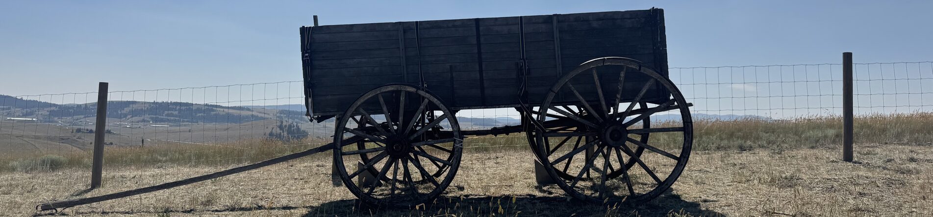 Heritage wagon overlooking BC grassland
